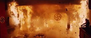 The Nazi Swastika falls in the cinema fire